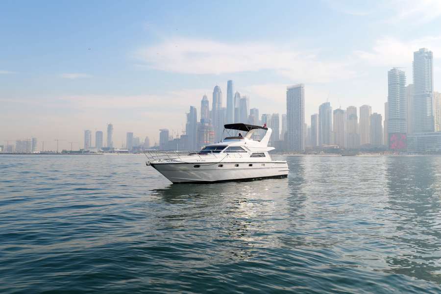 The 55-foot yacht cruising in front of the Dubai Marina skyline